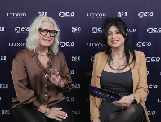 Two women engaged in conversation at conference